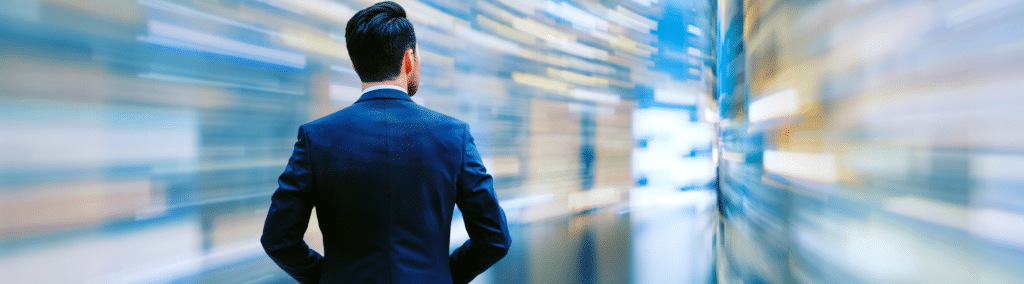Man in suit seen from behind